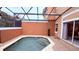 Private screened-in pool area with access from inside the house, perfect for relaxation at 8517 Bay Lilly Loop, Kissimmee, FL 34747