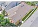Aerial view of a tan home featuring a brown roof, two car garage and white fenced in yard at 8835 Abbey Leaf Ln, Orlando, FL 32827