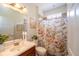 Bathroom featuring a vanity, toilet, and shower with a floral curtain at 8835 Abbey Leaf Ln, Orlando, FL 32827