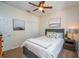 Cozy bedroom with neutral decor, comfortable bed, and ceiling fan at 8835 Abbey Leaf Ln, Orlando, FL 32827