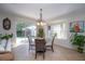 Bright dining area with sliding doors to the backyard at 8835 Abbey Leaf Ln, Orlando, FL 32827
