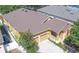 Exterior elevation of a two story home with a two car garage, brown roof, and front porch at 8835 Abbey Leaf Ln, Orlando, FL 32827