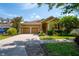 Lovely single-Gathering home with a two-car garage, well-maintained landscaping, and a cozy front porch at 8835 Abbey Leaf Ln, Orlando, FL 32827