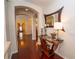 Inviting hallway with hardwood floors, archways, and stylish decor at 8835 Abbey Leaf Ln, Orlando, FL 32827