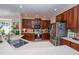 Well-lit kitchen with stainless steel appliances and wooden cabinets at 8835 Abbey Leaf Ln, Orlando, FL 32827