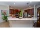 A spacious kitchen with stainless steel appliances and a breakfast bar at 8835 Abbey Leaf Ln, Orlando, FL 32827