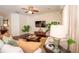 Cozy living room featuring modern furniture, plants, and a ceiling fan at 8835 Abbey Leaf Ln, Orlando, FL 32827