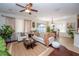 Inviting living room featuring large windows and an adjacent dining area at 8835 Abbey Leaf Ln, Orlando, FL 32827