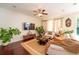 Comfortable living room featuring a TV, plants, and a cozy rug at 8835 Abbey Leaf Ln, Orlando, FL 32827
