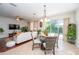 Open layout living and dining area with lots of natural light at 8835 Abbey Leaf Ln, Orlando, FL 32827