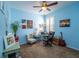 Office/flex room with blue walls, a ceiling fan, and lots of room for activities at 8835 Abbey Leaf Ln, Orlando, FL 32827