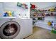 Walk-in pantry with wire shelving and a washer and dryer at 8835 Abbey Leaf Ln, Orlando, FL 32827
