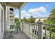 Balcony with views of the parking area and surrounding trees with blue sky at 1231 Wright Cir # 1213, Celebration, FL 34747
