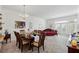 Spacious dining room featuring light carpet, a chandelier, and a daybed near a window at 1231 Wright Cir # 1213, Celebration, FL 34747
