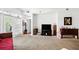 Cozy living room featuring neutral carpet and light walls, with access to a balcony at 1231 Wright Cir # 1213, Celebration, FL 34747