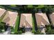 Aerial view showcases the property's layout, roof, landscaping, and proximity to neighboring homes and community at 1394 Palmetto Dunes St, Champions Gate, FL 33896
