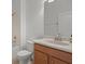 Bathroom featuring white vanity, toilet, tiled shower-tub, and large mirror at 1394 Palmetto Dunes St, Champions Gate, FL 33896