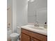 Bathroom featuring white vanity, toilet, tiled shower-tub, and mirror at 1394 Palmetto Dunes St, Champions Gate, FL 33896