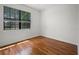 Bedroom featuring wood floors, one window, and neutral walls at 1394 Palmetto Dunes St, Champions Gate, FL 33896