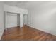 Large bedroom featuring wood-look floors, closet, and neutral color scheme at 1394 Palmetto Dunes St, Champions Gate, FL 33896