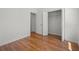 Bedroom featuring wood floors, neutral walls, and closet at 1394 Palmetto Dunes St, Champions Gate, FL 33896