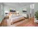Modern bedroom with a platform bed, minimalist decor, and light-colored walls at 1394 Palmetto Dunes St, Champions Gate, FL 33896