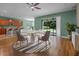 Bright breakfast nook with a round table, sliding glass doors, and views of the backyard at 1394 Palmetto Dunes St, Champions Gate, FL 33896