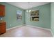Dining room with tile floors and windows to the backyard at 1394 Palmetto Dunes St, Champions Gate, FL 33896