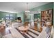 Bright living room featuring wood floors, comfortable seating, and open floor plan at 1394 Palmetto Dunes St, Champions Gate, FL 33896