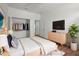 Bright bedroom with wood floor, plant, large closet and contemporary decor at 1394 Palmetto Dunes St, Champions Gate, FL 33896