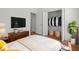 Open bedroom includes closet, wood floors and stylish decor elements at 1394 Palmetto Dunes St, Champions Gate, FL 33896