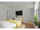 Well-lit bedroom featuring wood floors, modern design, and en suite bathroom at 1394 Palmetto Dunes St, Champions Gate, FL 33896