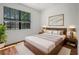 Bright, welcoming bedroom with modern design elements and wood-style flooring at 1394 Palmetto Dunes St, Champions Gate, FL 33896