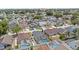 A neighborhood aerial view showcases this home with a screened-in pool, nicely situated within the community at 142 Ethan Ave, Davenport, FL 33897