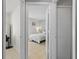 Neutral bedroom featuring cozy decor and tiled floors at 142 Ethan Ave, Davenport, FL 33897
