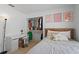 Cozy bedroom featuring tiled floors, work space, and closet at 142 Ethan Ave, Davenport, FL 33897