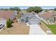Charming single-Gathering home featuring a well-maintained front yard, arched window, and an attached garage at 142 Ethan Ave, Davenport, FL 33897