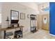 Inviting foyer with tiled floors, coat rack, decor, and chandelier at 142 Ethan Ave, Davenport, FL 33897
