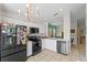 Well-equipped kitchen featuring stainless steel appliances and white cabinets at 142 Ethan Ave, Davenport, FL 33897