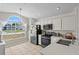 Bright kitchen with stainless appliances and natural light through large windows at 142 Ethan Ave, Davenport, FL 33897