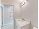 Well-lit bathroom with a modern vanity and a view into the hallway at 14512 Sw 25Th Lane, Ocala, FL 34481