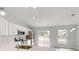 Modern kitchen with stainless steel appliances and a breakfast bar at 14512 Sw 25Th Lane, Ocala, FL 34481