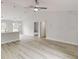 Spacious living room featuring a ceiling fan and open layout to the other areas at 14512 Sw 25Th Lane, Ocala, FL 34481