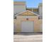Up-close picture of a two-car garage door with visible unit number at 1501 Northern Harrier Way # 202, Reunion, FL 34747