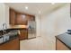 Modern kitchen with stainless steel refrigerator and dark countertops at 1501 Northern Harrier Way # 202, Reunion, FL 34747