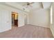 Large main bedroom with a ceiling fan and ensuite bathroom entrance at 1501 Northern Harrier Way # 202, Reunion, FL 34747