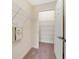 Walk-in closet with built-in shelving and a mounted safe at 1501 Northern Harrier Way # 202, Reunion, FL 34747