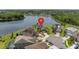 Aerial view of homes in a lakeside community with lush landscaping and cul-de-sac streets at 15037 Cedar Branch Way, Orlando, FL 32824