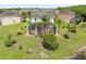 Aerial view of a home with a large screened in patio overlooking the lake at 15037 Cedar Branch Way, Orlando, FL 32824
