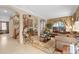 Inviting living room featuring comfortable seating, staircase, and archway at 15037 Cedar Branch Way, Orlando, FL 32824